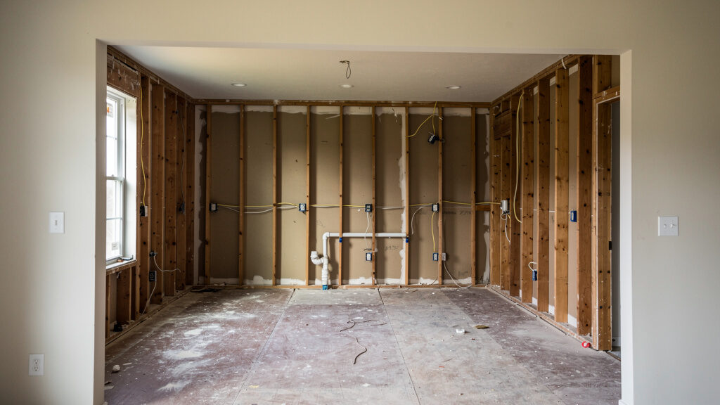 Comprehensive kitchen space being cleared for renovation
